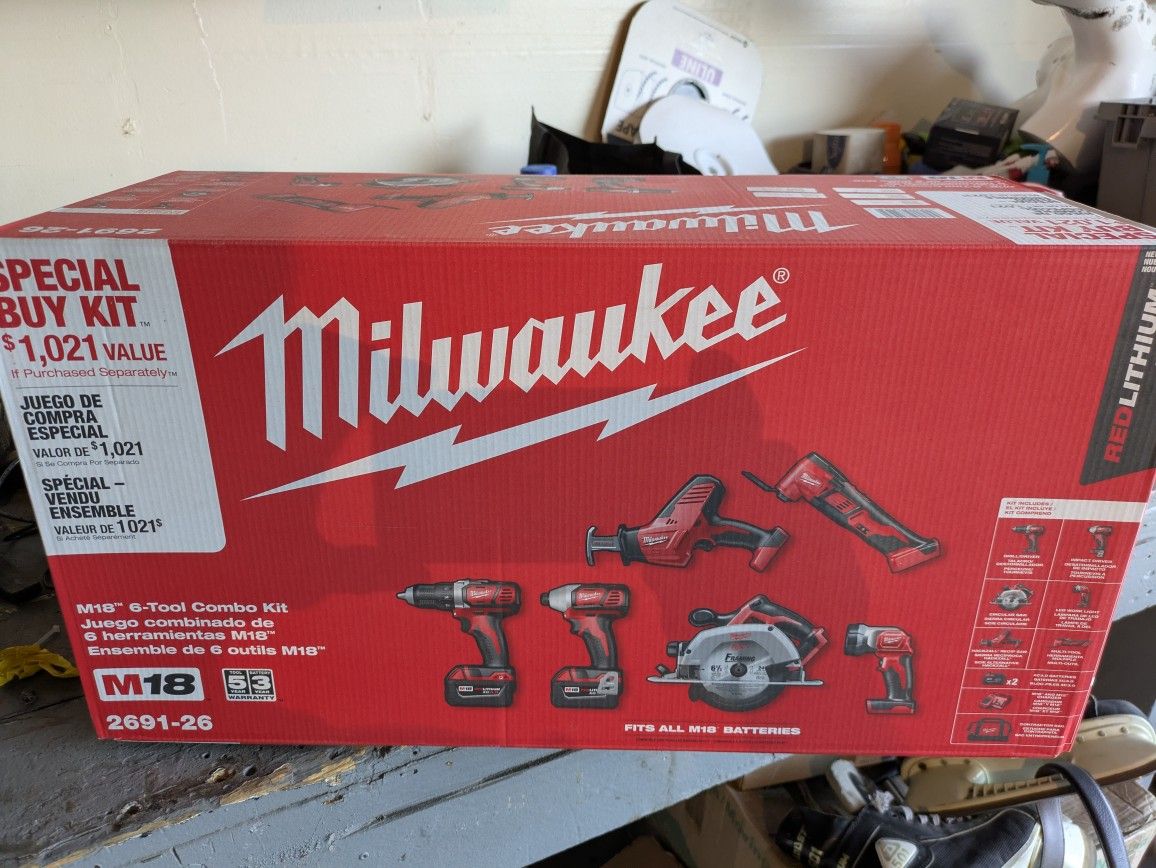 UNOPENED MILWAUKEE MULTI TOOL SET W/ 2 BATTERIES