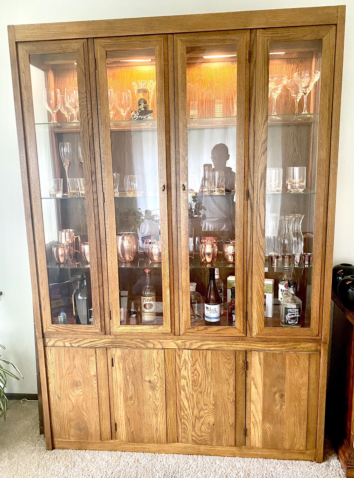 Vintage china/ bar cabinet w/ glass shelving and working lights.