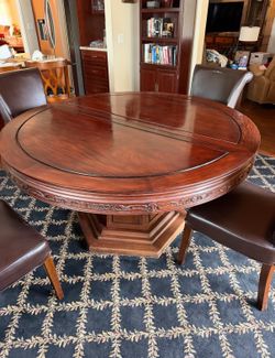 Beautiful vintage table. Includes two leaves, two Lazy Susan’s, protective pads, and cloths. Beautiful vintage table. Includes two leaves, two Lazy Su