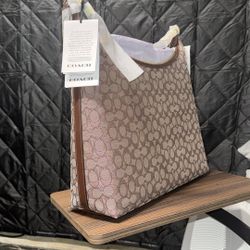 Coach Juliet 38 shoulder bag in signature jacquard fabric.+ Coach Faux Stone Enamel Signature Bangle Bracelet Set in chalk and gold. 