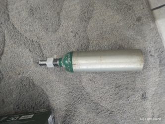 Oxygen Bottles And A Walker,Wheel Chair, And Hospital Bed