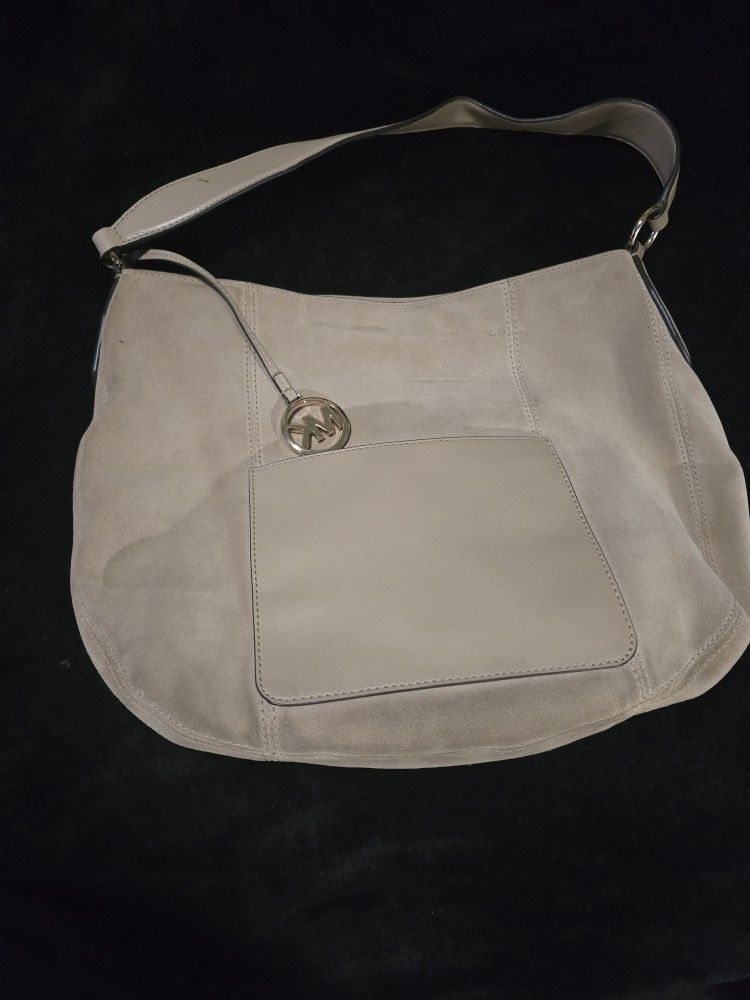 Michael kor's purse leatherlike.