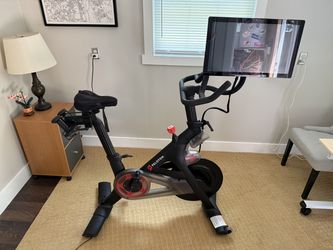 Peloton Bike | Low Use (40–50 Rides) | 2 Pairs Shoes, Weights & Swivel Mount Inc