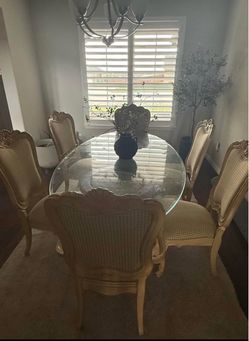 Antique Glass dining table with concrete pedestals and 6 chairs