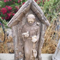 Saint francis stone statue