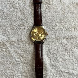 Watches, gold one is running now, Timberland needs battery.