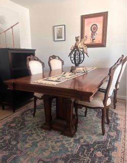 Antique table and dining set with matching chairs and buffet