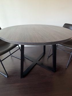 Ashley table with 2 chairs ,first person that brings $75 firm for everything take it Costa Mesa