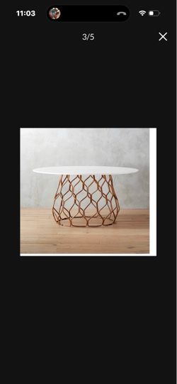 Cb2 table with 6 brass chairs
