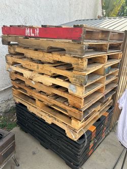 Total of 24 pallets, including both plastic and wooden pallets. $100 for all.