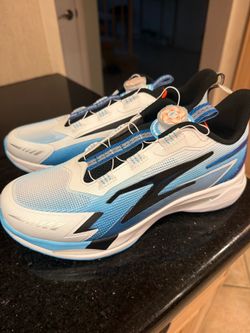 Blue and white athletic shoes