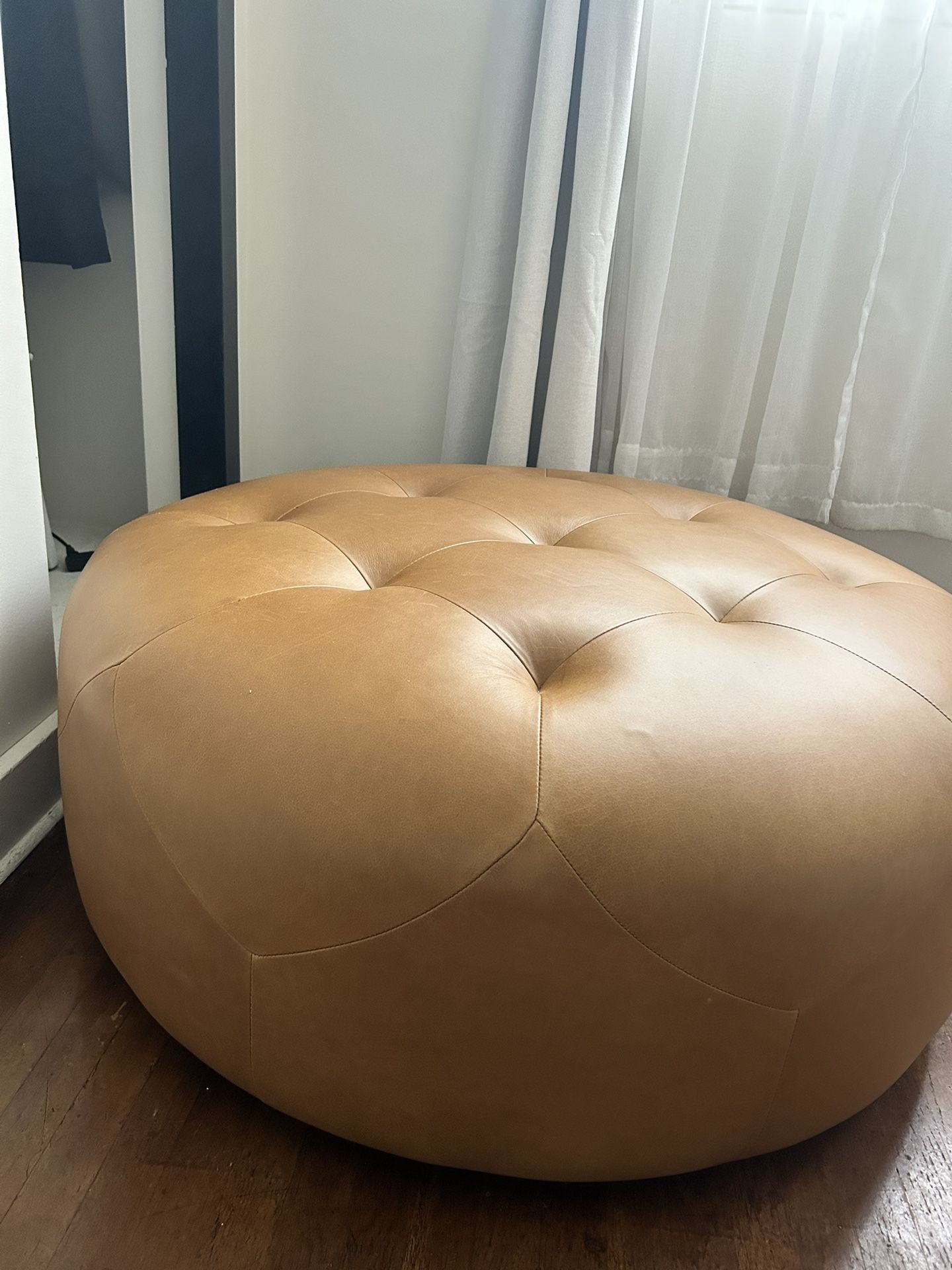 Leather ottoman online article