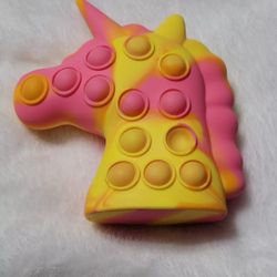 3- D Unicorn Pop fidget toy with Lights Stress Relief. Pink & Yellow Beautiful!