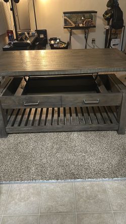 Coffee table with compartment