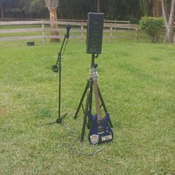 Amp, Electric Guitar And Microphone With Stand