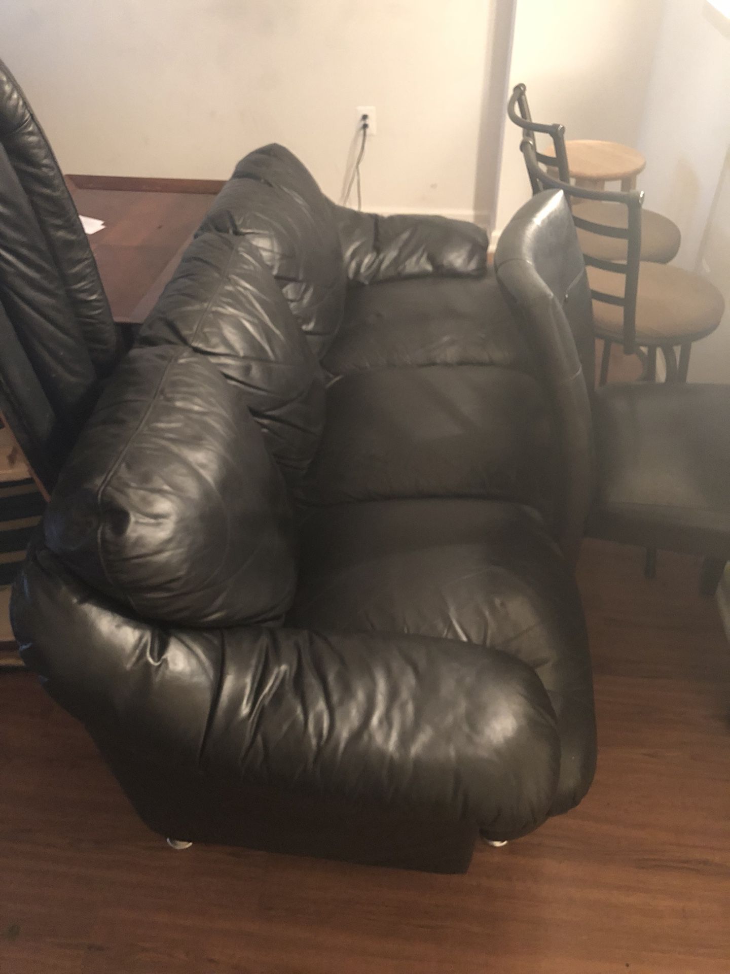 2 black leather couches- need gone