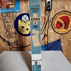 Original 1950s 10 cent vending machine loaded with product.