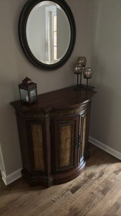 Chest and round mirror