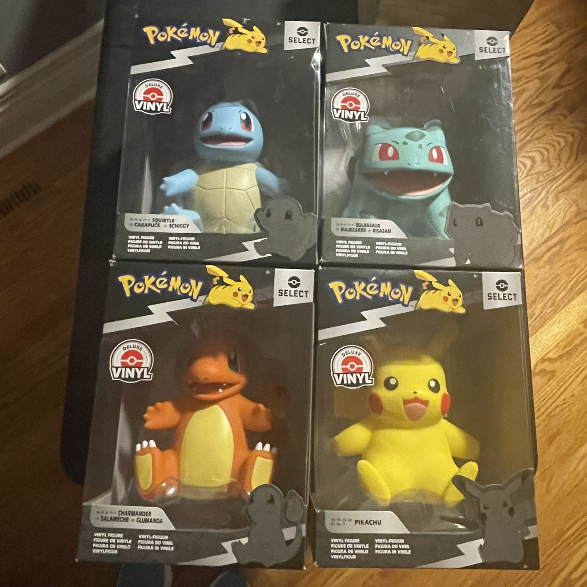 4 New In Box Pokémon Deluxe Vinyl 8" Figures - Pikachu Charmander Squirtle Bulbasaur