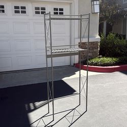 Bathroom gray metal over the toilet rack