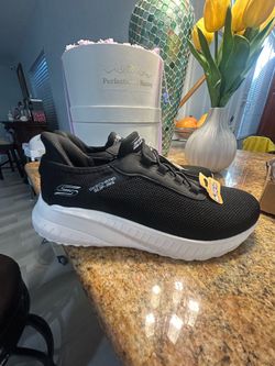 Skechers slip on brand new bk/white no box size 9.5 men 11 lady