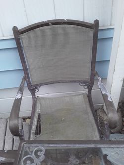 Patio set 1 chair is ripped 1 good chair and table best offer
