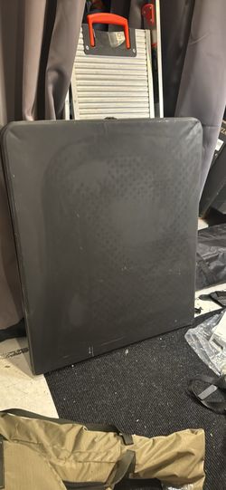 Black plastic folding Table.