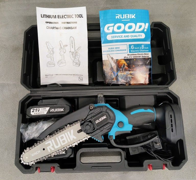 Mini Chainsaw. 6" Brushless. 
Built-In Oiling.  
Two (2) 21-Volt Batteries.

