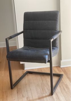 Contemporary black armchair with factory distressed finish