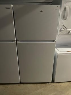 never used  midea white top freezer refrigerator