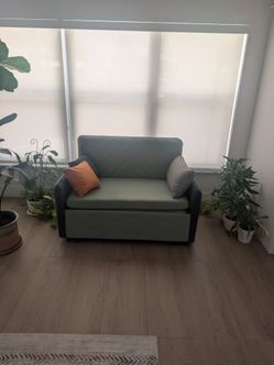 Brand new never used green loveseat sleeper from homary
