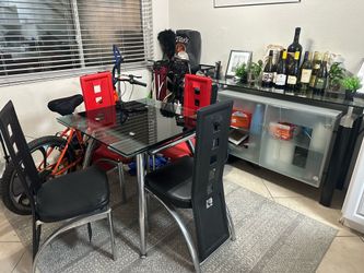 Glass table with 4 chairs AND a Glass Buffet with storage