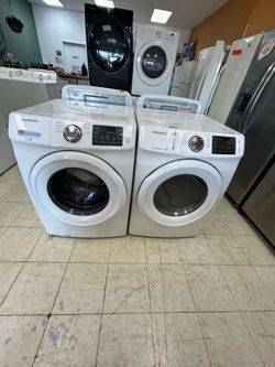 Samung white front load stackable washer and dryer set works great comes with warranty