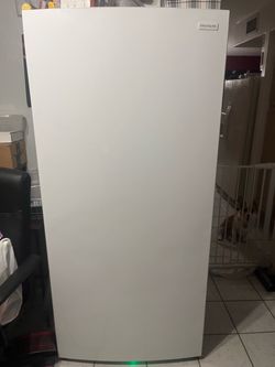 Frigidaire upright freezer.