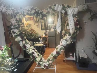 Wedding Arch heart shaped.  Fake flowers