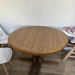 Solid Table with 2 leaf extensions 47"