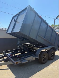 Scissor lift dump trailer