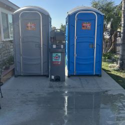 two porta potty’s and sink 