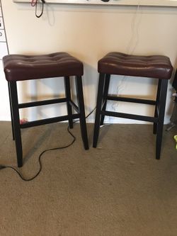 Burgundy or like a brick red leather bar stools