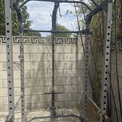 squat rack with weights and bar