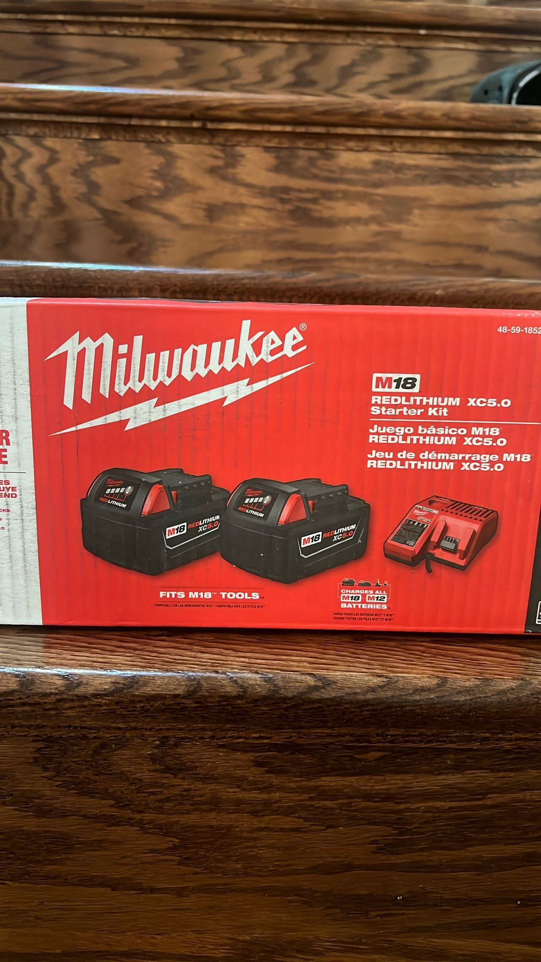 Two 5ah Milwaukee Battery And Charger