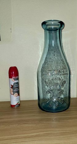Giant glass embossed 1890 milk bottle