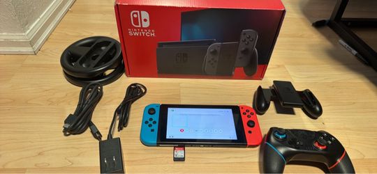 Nintendo switch with Lego Harry Potter with documentation, extra controller, joy, con grip, steering wheel charger and box