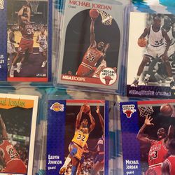 Real authentic basketball cards, Michael Jordan, Magic Johnson, Shaquille O’Neal, Charles Barkley. They’re all worth 200 or more make your special er.