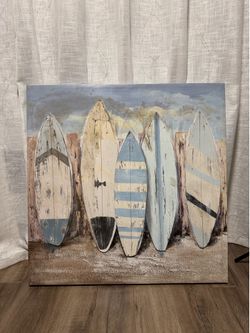 The wall panel depicts five vintage surfboards.