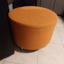 2 Orange Ottomans