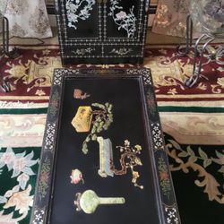 Vintage oriental table and cabinet made of natural wood inlaid with mother-of-pearl.