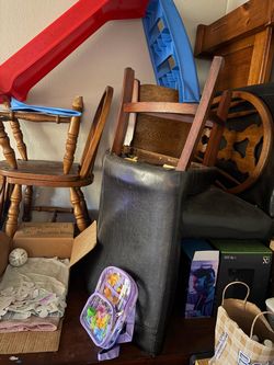 Brown square wooden table with soft seat chairs & storage department underneath table