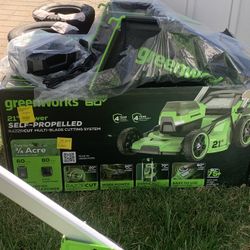 New Green Works electric 60 Volt 21 Blade lawnmower And Charger 