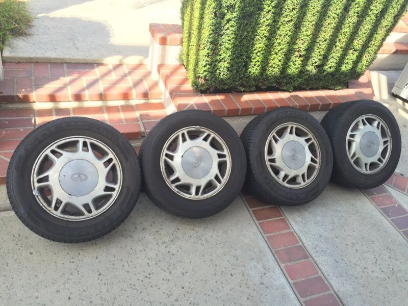 4 Factory OEM Infiniti J30 15" wheels and tires 215/60/15 Nissan